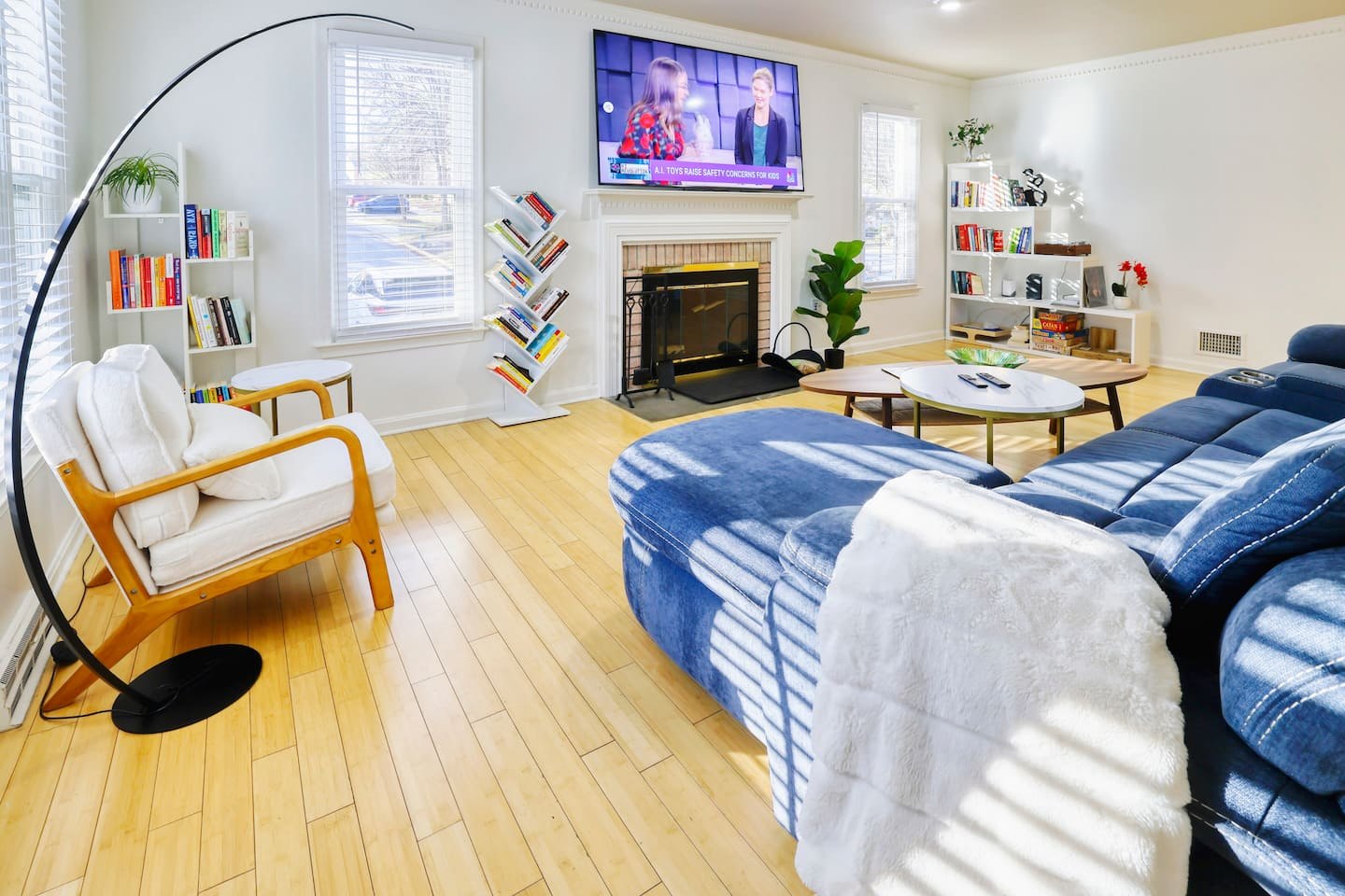 The Oasis living room with comfortable seating and a large smart TV